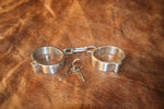 Locking Oval Brushed Stainless Steel Connected Wrist Cuffs - Medium/Large